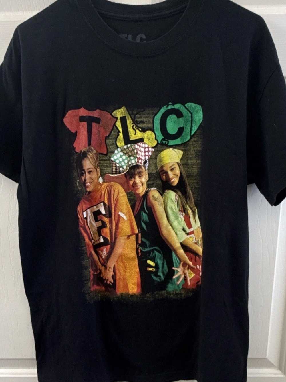 TLC Black Tee with Red, Yellow & Green Graphic